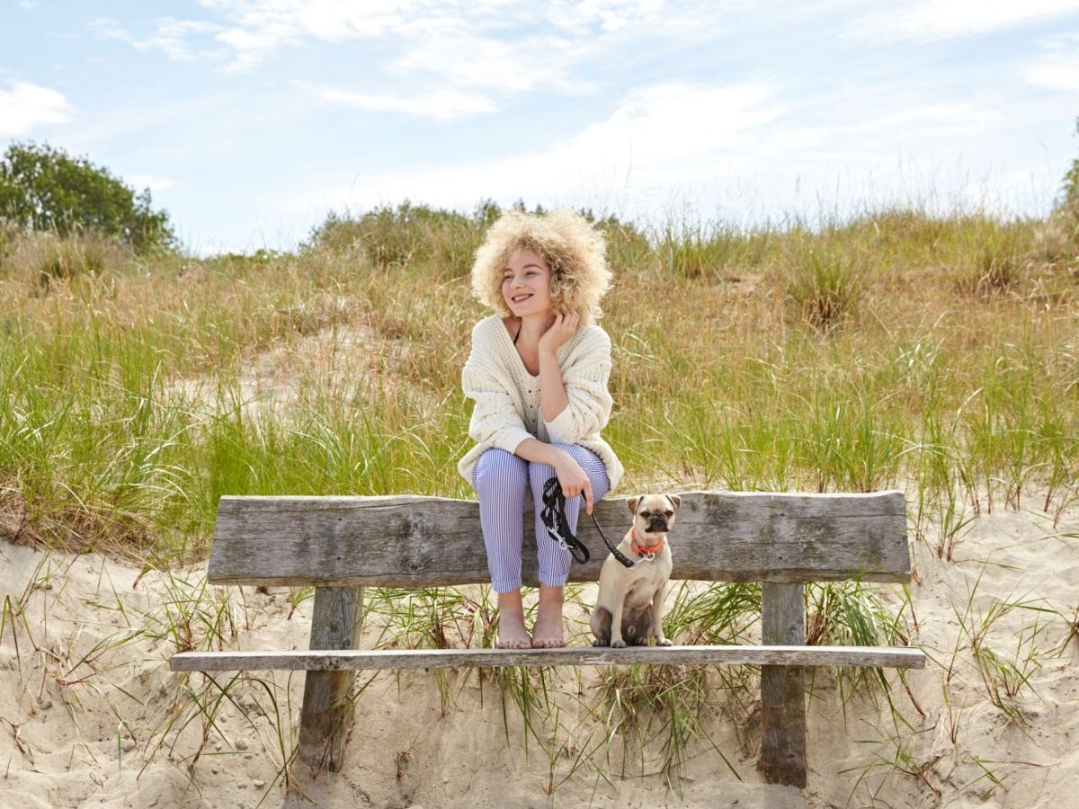 Fun Facts über Sylt Frau Strand Hund